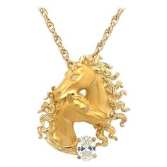 Beautiful creation from famed designer Carrera Y Carrera. Crafted in 18k yellow gold this horse themed diamond pendant is more than a necklace it is a piece of art! Details are endless as both satin and high polish techniques are seen to highlight specific portions of the pendant. Bold definition is seen in the horses face, making them appear life like. The pendant highlights one earth mined natural oval cut diamond. The diamond weighs 0.51 carat and adds a elegant sparkle to this already one of Classic Horse Design Pendant Necklace, Formal Horse Design Pendant Jewelry, Elegant Formal Necklace With Horse Design, Luxury Diamond Necklace For Collectors, Elegant Horse Design Pendant Jewelry, Exquisite Gold Necklace For Collectors, Elegant Round Jewelry With Horse Design, Elegant Gold Jewelry With Horse Design, Collectible Diamond Necklace Fine Jewelry