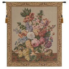 a tapestry with flowers in a vase on a table cloth hanging from a wall frame