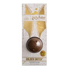 harry potter golden snitch chocolate egg in its packaging on a white background with gold foil