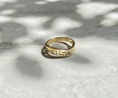 Handcrafted of solid 14K gold, this ring features an ancient Greek Meandros design, or Greek Key pattern. Wavy shape. The MEANDROS is a common decorative element in Greek art and was among the most important symbols in antiquity, symbolizing infinity and unity.Available in sizes 5-8.2.15 grams. Handmade Art Deco Gold Ring, Double Rings, Greek Key Pattern, Coin Ring, Greek Art, Vermeil Jewelry, Double Ring, Shiny Things, Greek Key