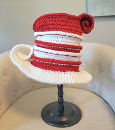 Hand crafted tilted red and white striped cat in a hat inspired steampunk top hat for all your costume needs.  Perfect for your upcoming school performances or raves.  This hat measures approximately 22 inches at the brim without being stretched, which will best fit an average sized adult. Please measure yourself accordingly. Hat is double stranded for extra stiffness and durability and will have slightly less stretch than other styles. Item is made of 100% Acrylic yarn and double stranded to give it a little extra stiffness to maintain its shape.   *Pattern adaptation credit to crochetverse. Red Brimmed Hat For Costume, Themed Fitted Hat For Cosplay, Red Themed Hat For Costume Party, Fitted Hat With Curved Brim For Cosplay, Themed Red Costume Hat, Fitted Curved Brim Hat For Cosplay, Fitted Brimmed Hat For Cosplay, Hat Cosplay, Steampunk Top