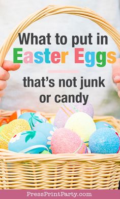 someone holding a basket full of easter eggs with the words what to put in easter eggs that's not junk or candy