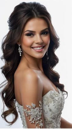 a woman in a white dress with long hair and earrings on her head, smiling at the camera