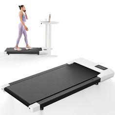 a woman is walking on a treadmill