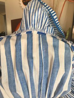 "Whimsical and fun! Cheerful royal blue vertical stripes with accent trims of red and yellow. *Belt not included Measurements: 33\" bust 23\" waist unstretched 34\" waist stretched 8-1/4\" from underarm to waist 23\" from waist to hem 4-18\" spaghetti straps 46\" flared hips 32\" from top of back to hem" Fitted Spring Dresses With Contrast Stripes, Spring Fitted Dresses With Contrast Stripes, Fitted Dress With Contrast Stripes For Spring, Fitted Summer Dresses With Striped Hem, Fitted Short Sleeve Dress With Striped Collar, Fitted Short Sleeve Dress With Vertical Stripes, Fitted Dress With Vertical Stripes And Short Sleeves, Cotton Spring Dresses With Striped Sleeves, Spring Cotton Dresses With Striped Sleeves