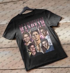 Milo Manheim Vintage T-Shirt, Homage Retro 90s Graphic, Ideal Gift for TV Series and Movies Enthusiasts 📏 IMPORTANT NOTICE ABOUT SIZING: For that oversized look, we suggest going two sizes up from your regular size. This ensures you get the comfy, roomy fit you want. Check our sizing guide for help picking the right size to match your style. ----------------------------------- 🌈 PRODUCT INFO: The unisex heavy cotton tee is a must-have in any wardrobe. It's the go-to for casual fashion and just Milo Manheim, Oversized Look, Retro 90s, Vintage Tshirts, Heavy Cotton, Cotton Tee, Tv Series, Ideal Gift, Casual Fashion