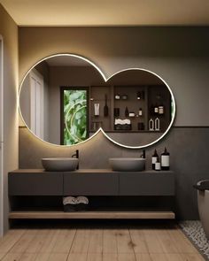 a bathroom with two circular mirrors above the sinks