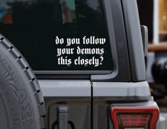 a jeep with the words do you follow your demons this closet? on it's side