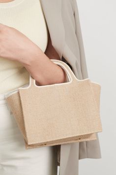 FINAL SALE A spin on our classic leather tote. The perfect little bag for your summer coffee dates with the girls or a date night down the coast. Ideal for little bag for your spring & summer essentials. Created in a jute fabric. Materials & Care: - Outer: 100% Undyed Jute - Lining: BCI Cotton - Trim: 100% Cowhide Leather - Gentle Spot Clean Only Dimensions: - Width: 29cm - Length: 21cm - Height: 16cm - Depth: 7cm Please note, due to the nature of the jute fabric, the texture of the bag may var Classic Leather Tote, Summer Coffee, Tiktok Outfits, Jute Fabric, Coffee Dates, Mini Tote Bag, Coffee Date, Mini Tote, Classic Leather