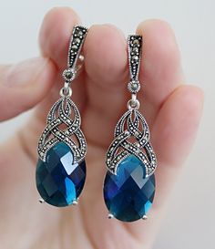 Royal blue jewelry dangle earrings marcasite jewelry marcazite Drop earring Unusual sky blue jewellery electric color Beautiful jewels Please note that the color of the stones changes in different light. WE MAKE THESE EARRINGS IN ANY COLOR (stone): RED, BLUE, BLACK, BROWN, GREEN, PINK, etc. EARRINGS: Length: 5 cm = 2 inch Weight: 9 grams. The stone is lab topaz. Shipping time: Europe 3-5 weeks. USA and other countries 3-5 weeks I don`t accept returns and exchanges. Request a cancellation within: Blue Sterling Silver Earrings With Intricate Design, Sterling Silver Blue Earrings With Intricate Design, Blue Earrings With Intricate Design For Gift, Blue Intricate Design Drop Earrings, Royal Blue Jewelry, Pomegranate Jewelry, Blue Jewellery, Marcasite Earrings, Marcasite Jewelry