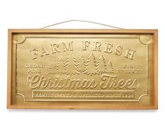 a wooden sign that says farm fresh christmas trees