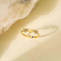 14K Solid Gold Stackable Minimalist Three Heart Ring with Cubic Zircon - Dainty Triple Hearth Band Ring for Anniversary Gift - Christmas Gift * PRODUCT FEATURES * ✔️Band Width: 1.70 mm ✔️Top Width: 4.54 mm x 16.57 mm ✔️Thickness: 1.30 mm ✔️Gemstone: AAA Grade White Cubic Zirconia Crafted from 14K solid gold, this stackable minimalist ring features three delicately designed hearts adorned with cubic zirconia. The dainty triple heart band creates an elegant and timeless piece, making it a perfect Gold Heart-shaped Crystal Promise Ring, Gold Crystal Promise Ring For Valentine's Day, Gold Heart-shaped Promise Crystal Ring, Heart-shaped Gold Crystal Promise Ring, Triple Heart, Heart Band, Fine Jewelery, Minimalist Ring, Gift Product