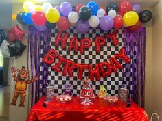 a birthday party with balloons and decorations