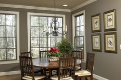 a dinning room table with chairs and a chandelier