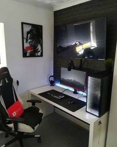 a computer desk with a monitor, keyboard and mouse