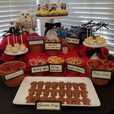 an assortment of desserts and snacks displayed on a table