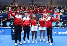 the canadian women's tennis team celebrates their victory