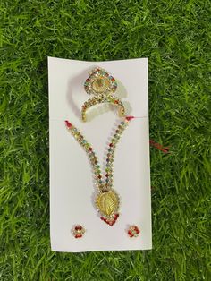 Beautiful Mukut with necklace and earrings set for our Krishna ji Available for Laddu Gopal in Size 3 and Size 4 Can be used for other deity idols Designer piece  Quality guaranteed  From land of Krishna, Mathura Temple Jewelry Sets For Festivals, White Temple Jewelry Sets As Gift, White Temple Jewelry Set For Gift, Silver Jewelry Sets For Puja And Festivals, Festive Spiritual Multicolor Temple Necklace, White Spiritual Festive Jewelry, Festival Gift Sets With Latkans, Multicolor Hand Set Jewelry Sets As Gift, Multicolor Hand Set Jewelry Sets For Gifts