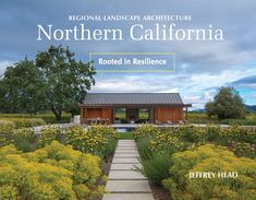 the front cover of a magazine with flowers and plants around it, along with a path leading to a pavilion