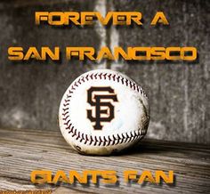 a baseball sitting on top of a wooden table with the words forever a san francisco