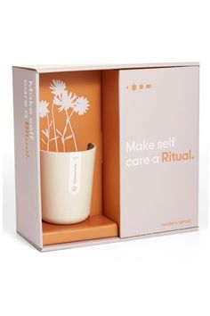 an orange and white box with a flower in it that says make self care ritual