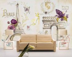 a living room scene with the eiffel tower and flowers in vases on the floor