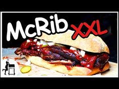 there is a sandwich with meat and sauces on it that says mcrib xxl