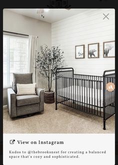 a baby crib sitting in the middle of a living room next to a window