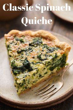 a slice of spinach quiche on a plate with a fork