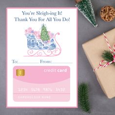 a gift card with a christmas tree on it next to some presents and a present