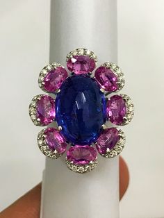 Inspired by the fantastic variety of shapes and colors, this ring offers a surprising and charming balance between the gold structure of the ring and the delicacy of the carefully selected gemstones. The result is a harmonic and sophisticated ring with a unique character. The gemstones are firmly set, and connected to the ring structure with love. This tanzanite cabochon promise ring or anniversary ring is crafted in solid 18k white gold. The timeless and classic design of this beautiful ring wi Engagement Ring Luxury, Tanzanite Engagement Ring, Luxury Engagement Rings, Ring Luxury, Beautiful Tiaras, Tanzanite Diamond Ring, Pink Sapphire Ring, White Gold Wedding Rings, Natural Tanzanite