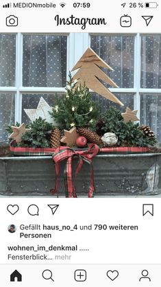 an instagram page with christmas decorations on the window sill and trees in it