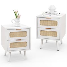 two white side tables with wicker drawers and one has a vase on the top