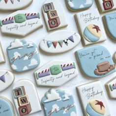 decorated cookies are displayed on a table for someone's special birthday or other celebration