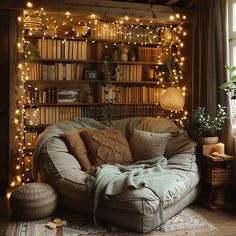 a living room filled with lots of furniture and bookshelves covered in fairy lights