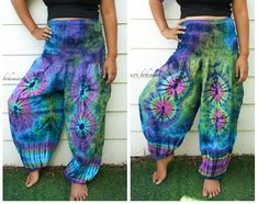 "💥One Size Fits Most Comfortable Unisex Tie Dye Harem Pants, Hippie Pants, Tie Dye Baggy Pants, Festival Harem Pants, Festival Clothing, Tye Dye Genie Pants, Tie Dye Comfy Pants 👉Fabric: Soft and Breathable Rayon 👉Smocked Elasticated Waist: 26\" up to 54\" 👉Hips up to: 60\" 👉Total Length: 45\" (Top to Bottom) 👉 Around elastic ankle 10\" 👉 Tie Dye Method 👉 One Size Fits S-XL or US 0-20 👉Extremely Comfortable 👉Boho/Hippie Theme, Beach Wear 👉2 Side Pockets Note: Due to the handmade natur Multicolor Loose Fit Harem Pants, Hippie Style Tie Dye Pants For Festival, Hippie Style Tie-dye Pants For Festival, Hippie Multicolor Harem Pants, Tie Dye Hippie Harem Pants For Festivals, Hippie Tie Dye Harem Pants For Festivals, Tie-dye Hippie Harem Pants For Festivals, Hippie Style Multicolor Harem Pants, Multicolor Harem Pants With Loosely Fitted Hips