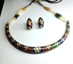 Decorated with three colors of enamel, red, blue green enamel studded with uncut diamond polkis, this is a unique necklace set. This diamond polki hasli set is sold. Available on reorder. Please call me at 91-9828012999 or email at WeCare Jewelove.in to reorder. You can also see the other Haslis at Jewelove diamond polki haslis. Platinum Chain, Pearl Necklace Designs, Platinum Wedding Band, Platinum Rose Gold, Antique Jewelry Indian, Wedding Jewellery Collection, Polki Jewellery, Diamond Jewelry Designs, Round Necklace