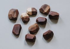 wood beads are arranged on a white surface