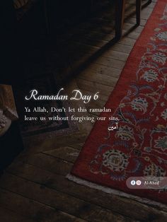 a red rug sitting on top of a wooden floor