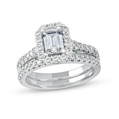 Display your love for all to see with the stunning design of this platinum emerald-cut diamond scallop frame bridal set. Fashioned in sleek platinum The 3/4 ct. emerald-cut center diamond sparkles in a scalloped diamond-lined frame. Additional diamonds shimmer along the shank. The coordinating diamond-lined wedding band completes the ensemble. This bridal set shines with 1-3/4 cts. t.w. of diamonds. Emerald Cut Cubic Zirconia Wedding Ring With Halo Design, Emerald Cut Cubic Zirconia With Halo Design For Wedding, Formal Emerald Cut Diamond Bridal Sets, Silver Wedding Ring With Halo Setting And Emerald Cut, Silver Emerald Cut Ring With Halo Setting, Silver Emerald Cut Halo Wedding Ring, White Emerald Cut Halo Jewelry, Wedding Halo Design Ring With Asscher Cut, Square Cut Wedding Jewelry With Diamond Accents