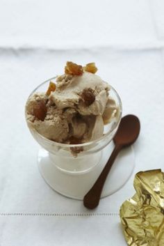 an ice cream sundae with raisins and caramel