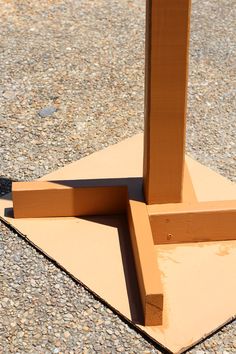 a piece of wood sitting on top of a cement slab