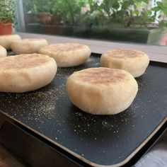 some food is cooking on a pan in the kitchen and it looks like they are ready to be cooked