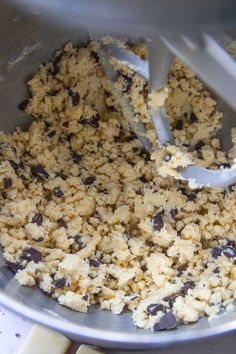 a mixing bowl filled with batter and chocolate chips