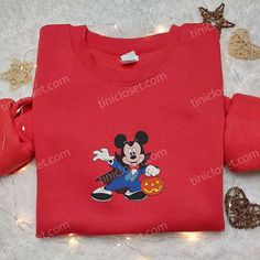 a red shirt with mickey mouse on it