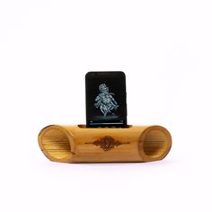 an electronic device is sitting on top of a wooden stand