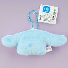 a blue stuffed animal with a tag attached to it