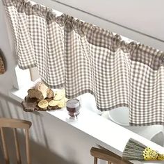 a kitchen window sill with some food on it and two chairs in front of it