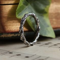 Meet the latest addition to our enchanting Silvestre stacking collection. It is meticulously designed to seamlessly blend with your current Dixi stack or stand out as a statement ring on its own. With its tightly bound Hawthorne branches, this latest addition brings a touch of nature with a gothic twist to your stacking ring collection. MaterialSterling Silver SizingHeight - 2mm