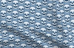 a blue and white background with skulls on it